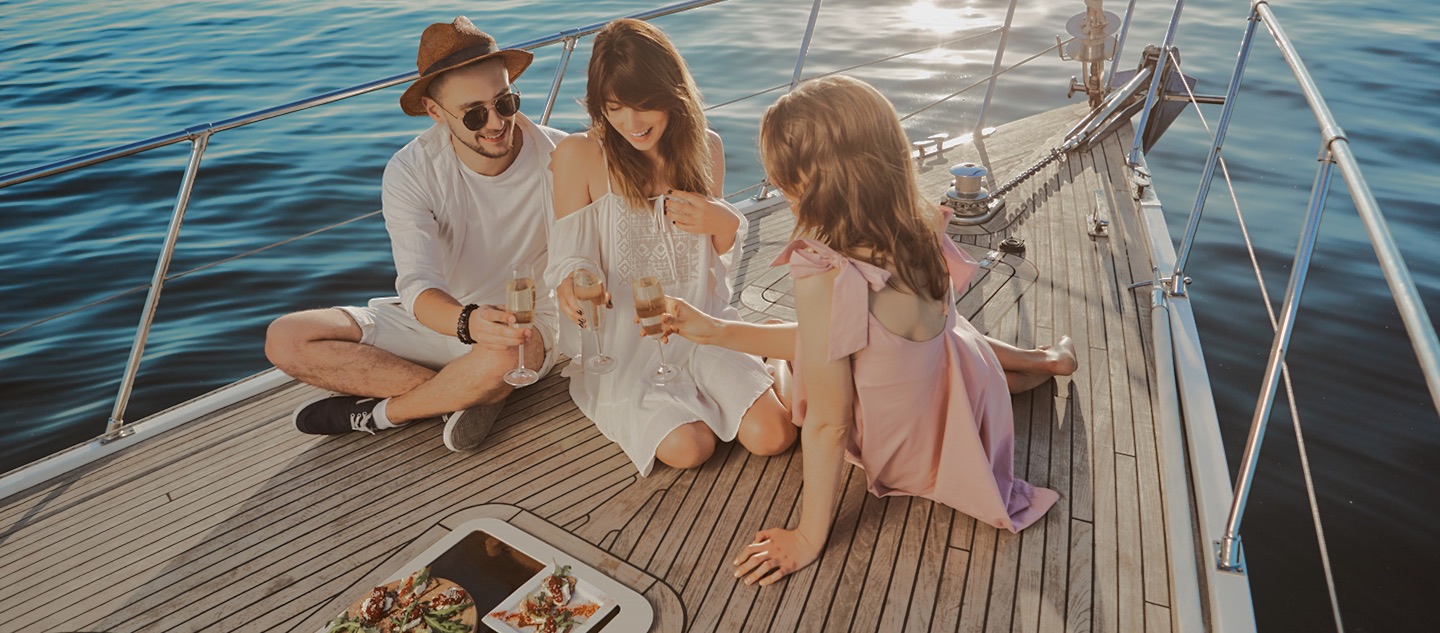 Friends toasting on the deck of a yacht